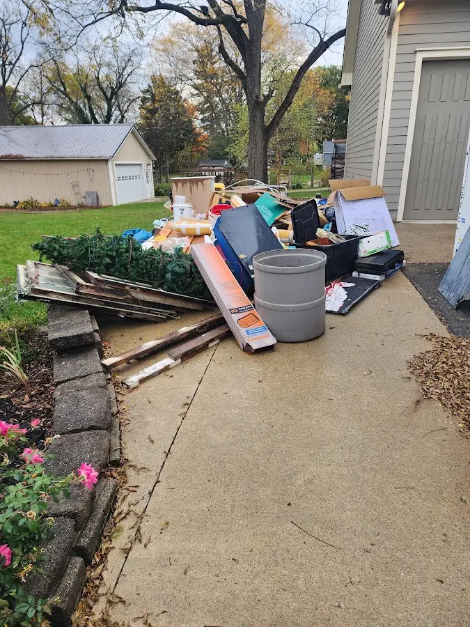 Dumpster being loaded with debris for Roofing Dumpster Rental in Waldorf